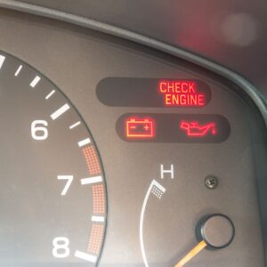 Car dashboard with check engine warning lights