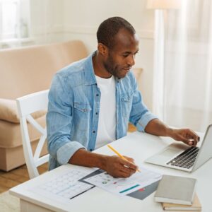 Man working on computer at home