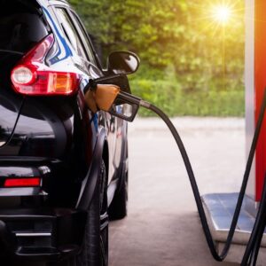 Car at gas station filling up 