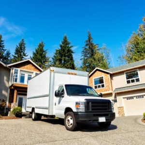 Moving truck in front of houses 