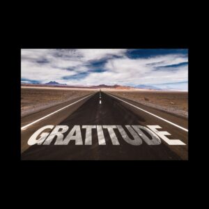 The word gratitude written across a highway 