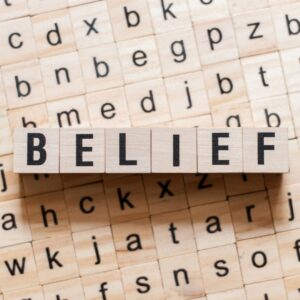 The word belief on a scrabble board