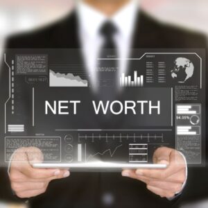 Man holding net worth sign