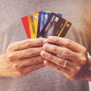 Person holding credit cards